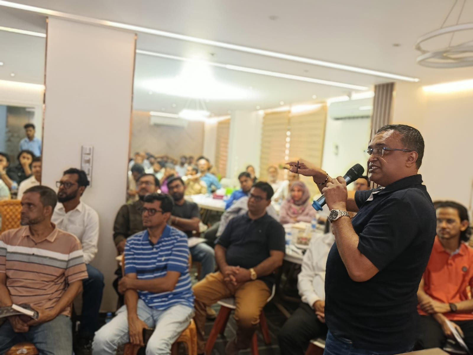 Md. Nazrul Islam addressing participants during the BGBA and DeviceStamp DPP Awareness and Training Program in Dhaka