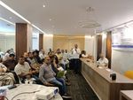 A speaker addresses participants at the BGBA × DeviceStamp DPP Awareness & Training Program 2026 at the BGBA Multipurpose Hall in Uttara, Dhaka